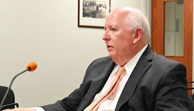 County to negotiate contract with Frank Walsh for county administrator