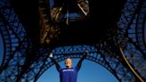 French athlete attempts record after climbing Eiffel Tower
