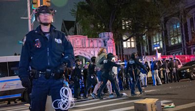 NYPD cops hoist US flag at City College after school worker tosses away Palestinian flag