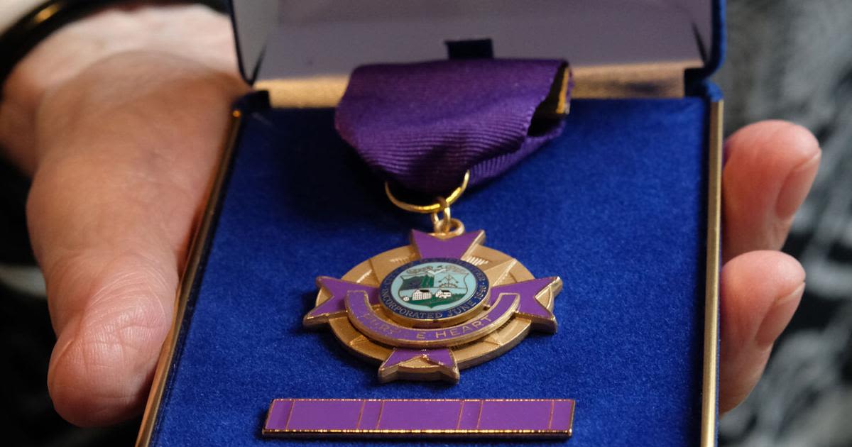 Manchester police officers honored with purple hearts