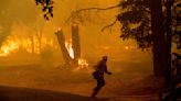 Thousands evacuate as Northern California wildfire spreads, with more hot weather expected