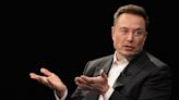 Elon Musk says Warren Buffett should buy Tesla shares