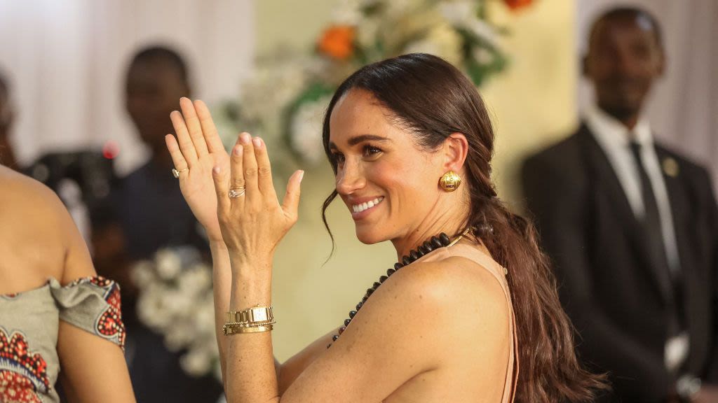 Meghan Markle Opted for a Pale Pink Maxi Dress on Day 1 of Her Trip to Nigeria