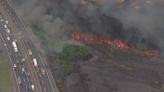 Large fire near NJ Turnpike in Secaucus put out after slowing traffic, halting rail service