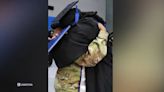 Mom deployed abroad in National Guard surprises son on college graduation stage