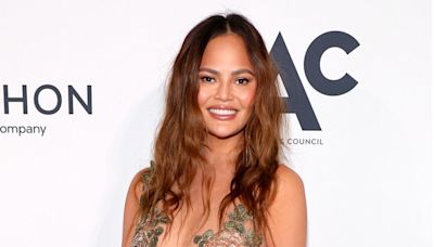 Chrissy Teigen Jokes What She Would Have Worn to Met But 'Wasn't Invited'