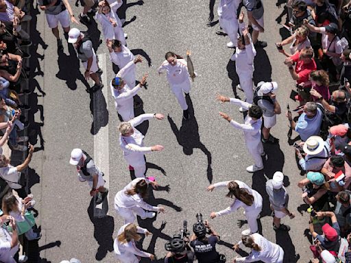 A Ukrainian gymnast carried the Paris Olympic torch with an EU team, in a sign of support