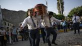 Peru’s dancing undertakers take sting out of death