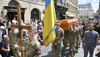 Thousands attend funeral of former Ukrainian lawmaker killed in Lviv