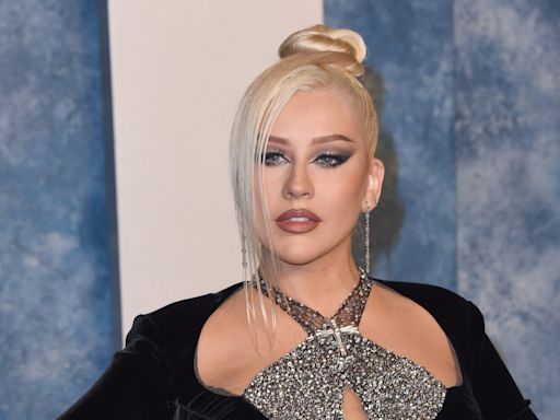 Christina Aguilera had to find 'balance' between work and motherhood: 'I'm trying to figure it out'