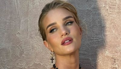 Rosie Huntington-Whiteley stuns in a semi-sheer lace jumpsuit in Italy