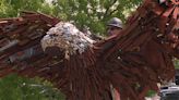 Metal eagle sculpture honoring military installed in Happy Valley