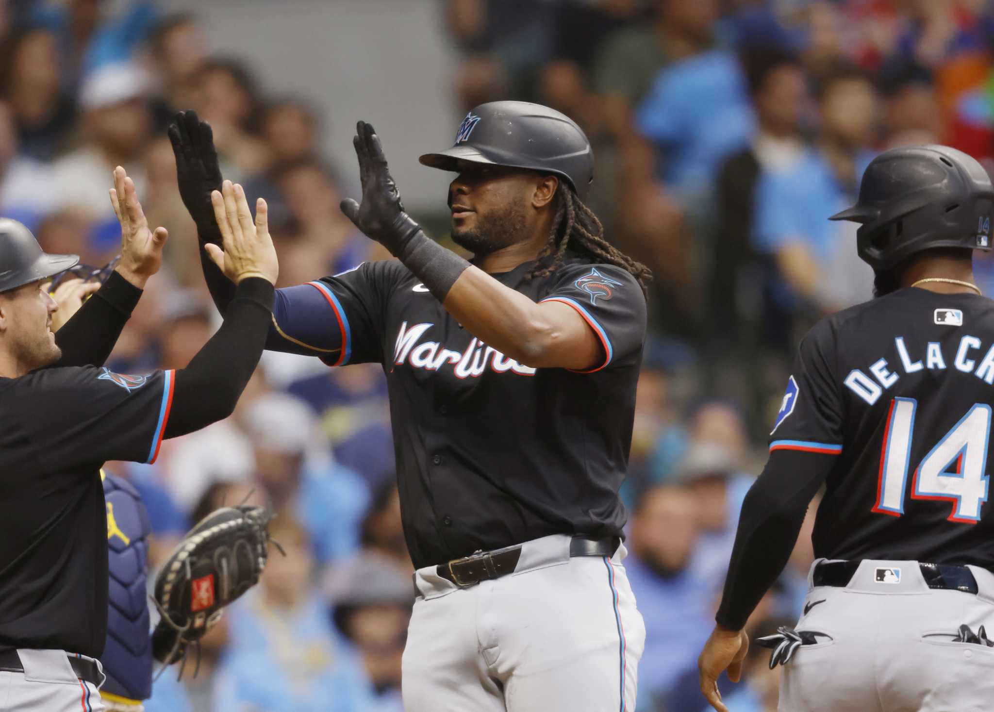 Bell's 3-run homer in 7th inning helps lift Marlins past Brewers 7-3