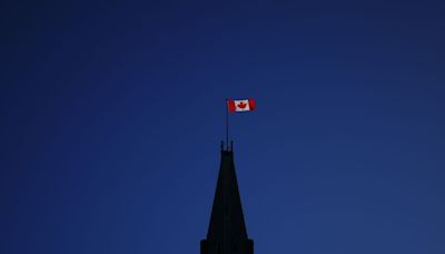 Different schools of thought on why Canada drapes itself with red and white