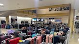 Bags piling up at DCA Delta baggage claim following global Microsoft outage disruptions