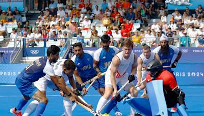 Olympics-Hockey-Belgium beat India to stay top, Britain, Argentina advance