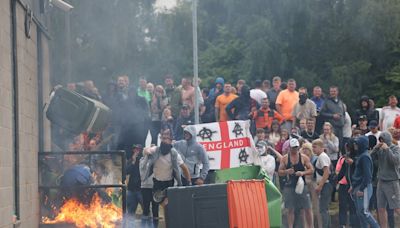 UK riots live: Belfast man in serious condition after suspected hate crime as police attacked in Plymouth