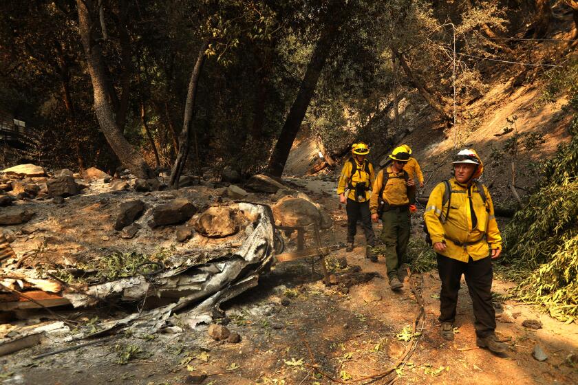 As weather conditions improve, firefighters make progress battling Southern California wildfires