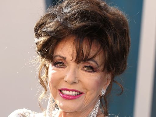 Sunkissed Joan Collins, 91, turns heads on luxurious yacht in Bardot top and seriously chic hat