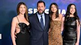 Adam Sandler shares a sweet moment with his wife and daughters on the red carpet