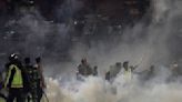 125 die as tear gas triggers crush at Indonesia soccer match