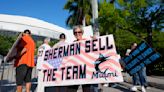 A handful of disgruntled Marlins fans protest the team following the Luis Arraez trade