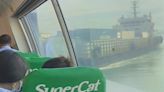 Dramatic moment ferry smashes into cargo ship