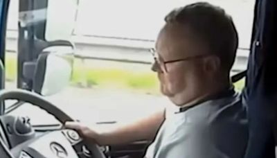 Shocking moment lorry driver 'looking for podcast' on phone ploughs into car