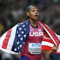 Sha'Carri Richardson celebrates after her upset 100m gold at last year's World Championships