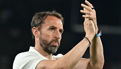 England fans throw plastic cups towards Gareth Southgate and BOO coach