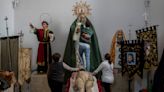 AP PHOTOS: The blessing of rain dampens Holy Week in drought-stricken Spain