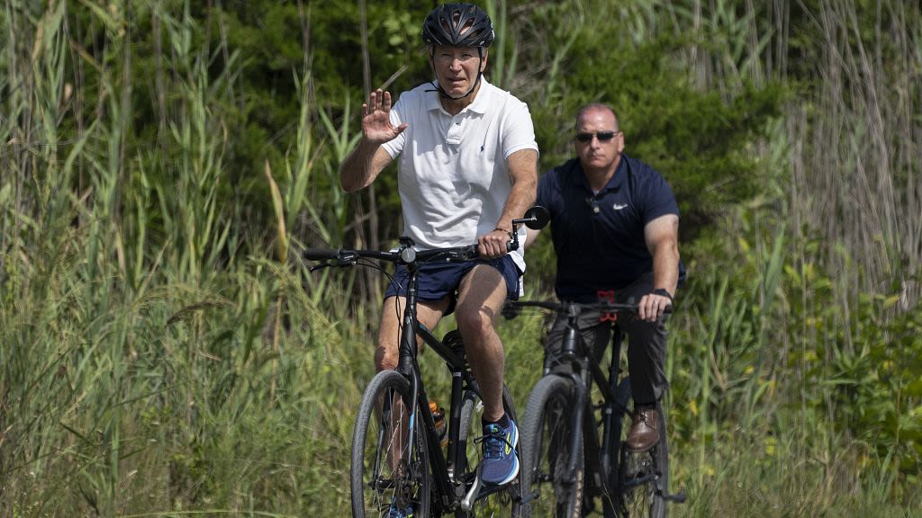 US President Joe Biden takes bike ride near beach house in Delaware