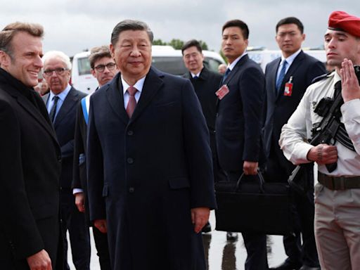 Macron and Xi have mountain outing and hope to ease tensions