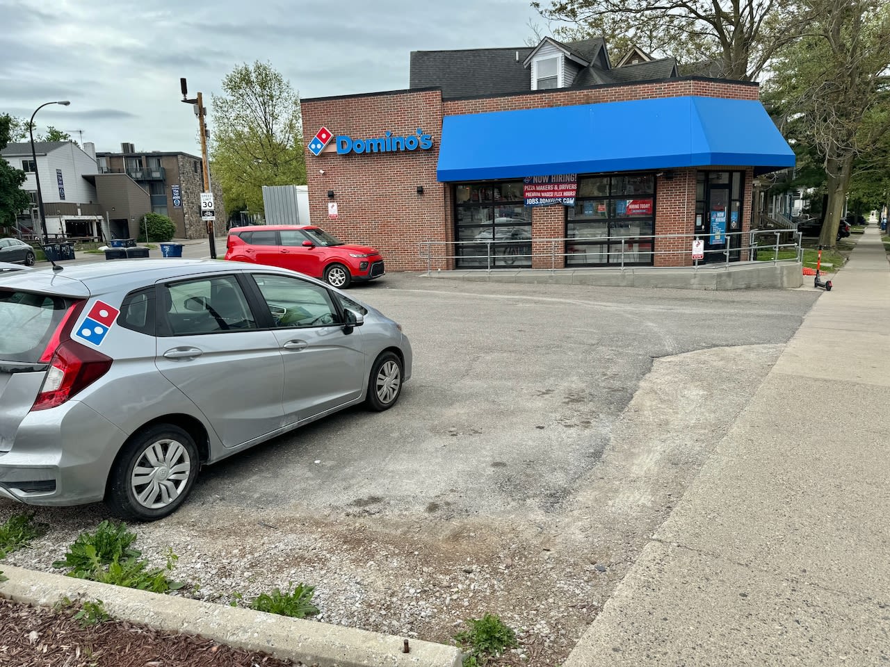 Hello, Ann Arbor: Domino’s Pizza property owner threatens legal action; students protest at commencement