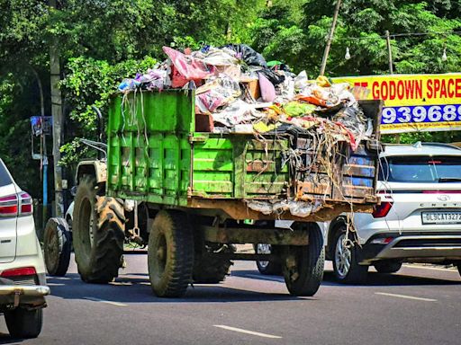 Another trash trouble: 'Trucks uncovered, spill waste on Dwarka e-way', NHAI writes to MCG | Gurgaon News - Times of India