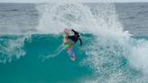 Mason and Michael Ho Trading Waves at Ehukai Beach Park