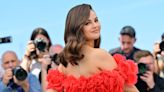Selena Gomez Wears Red Off-The-Shoulder Dress With Fabric Roses to Cannes Photocall