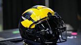 Sources: Michigan assistant at center of NCAA investigation purchased tickets to potential CFP opponents