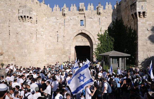 Israeli nationalists march through East Jerusalem, attack reporters