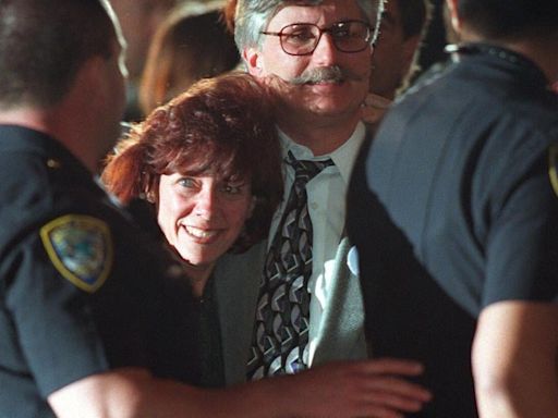 Fred Goldman, center, and his wife, Patti, leave a courthouse in Santa Monica, California, in 1997 after a jury found football star O.J. Simpson guilty in a civil trial...
