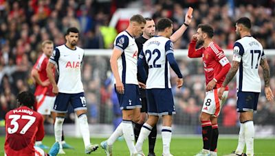 Manchester United’s Bruno Fernandes reacts after being shown a red card for his high challenge on Spurs’ James Maddison