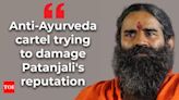 Baba Ramdev claims anti-Ayurveda cartel targeting Patanjali; trying to damage reputation - Times of India