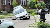 SUV falls into Uptown sinkhole