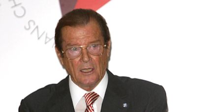 Sir Roger Moore gravesite 'vandalised with family shield stolen from tombstone'