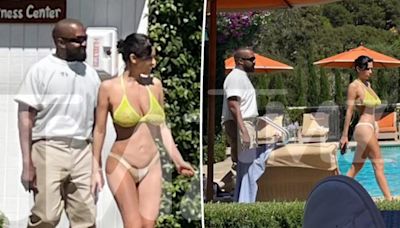 Bianca Censori steps out in a tiny bikini as Kanye West remains fully dressed at luxurious hotel outing in California