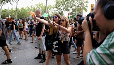 Furious Spanish locals attack tourists with water and yell 'go home'