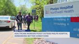 Health care workers picket outside Phelps Hospital demanding better conditions