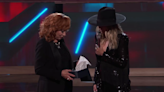 Reba McEntire invites Lainey Wilson to become an Opry member on 'The Voice' season finale