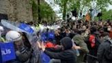 Turkish Protesters scuffle with riot police as they attempt to defy a ban and march on Taksim Square during a May Day rally in Istanbul