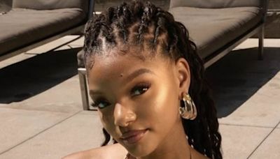 Halle Bailey shows off her incredible figure in a gold bikini